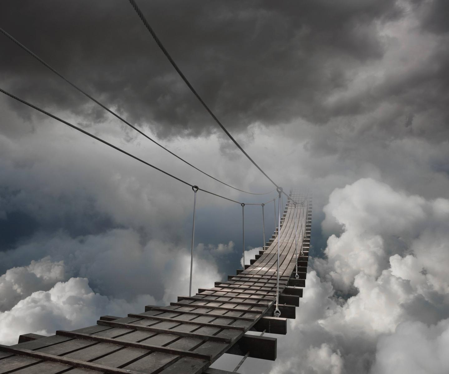 Wooden bridge in clouds