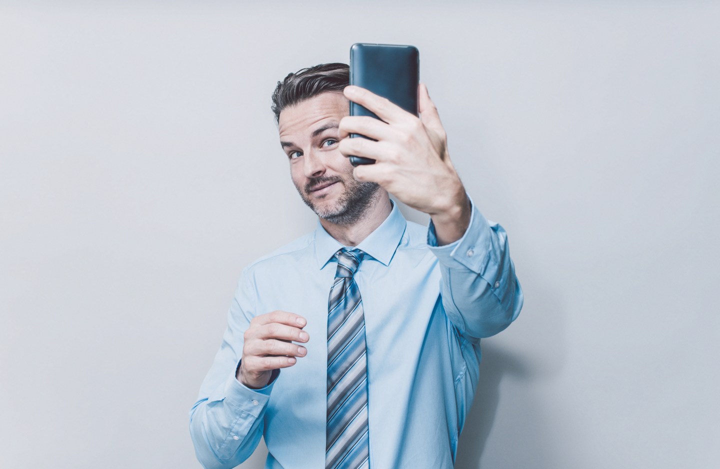 Business man taking a selfie
