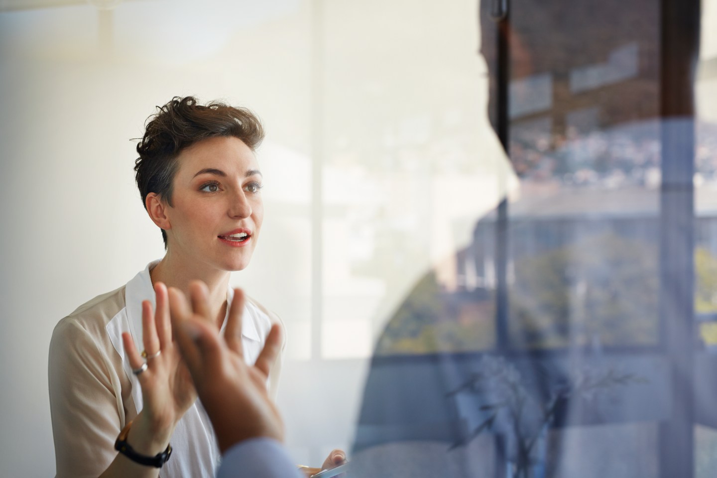 Businesswoman having discussion with male colleague