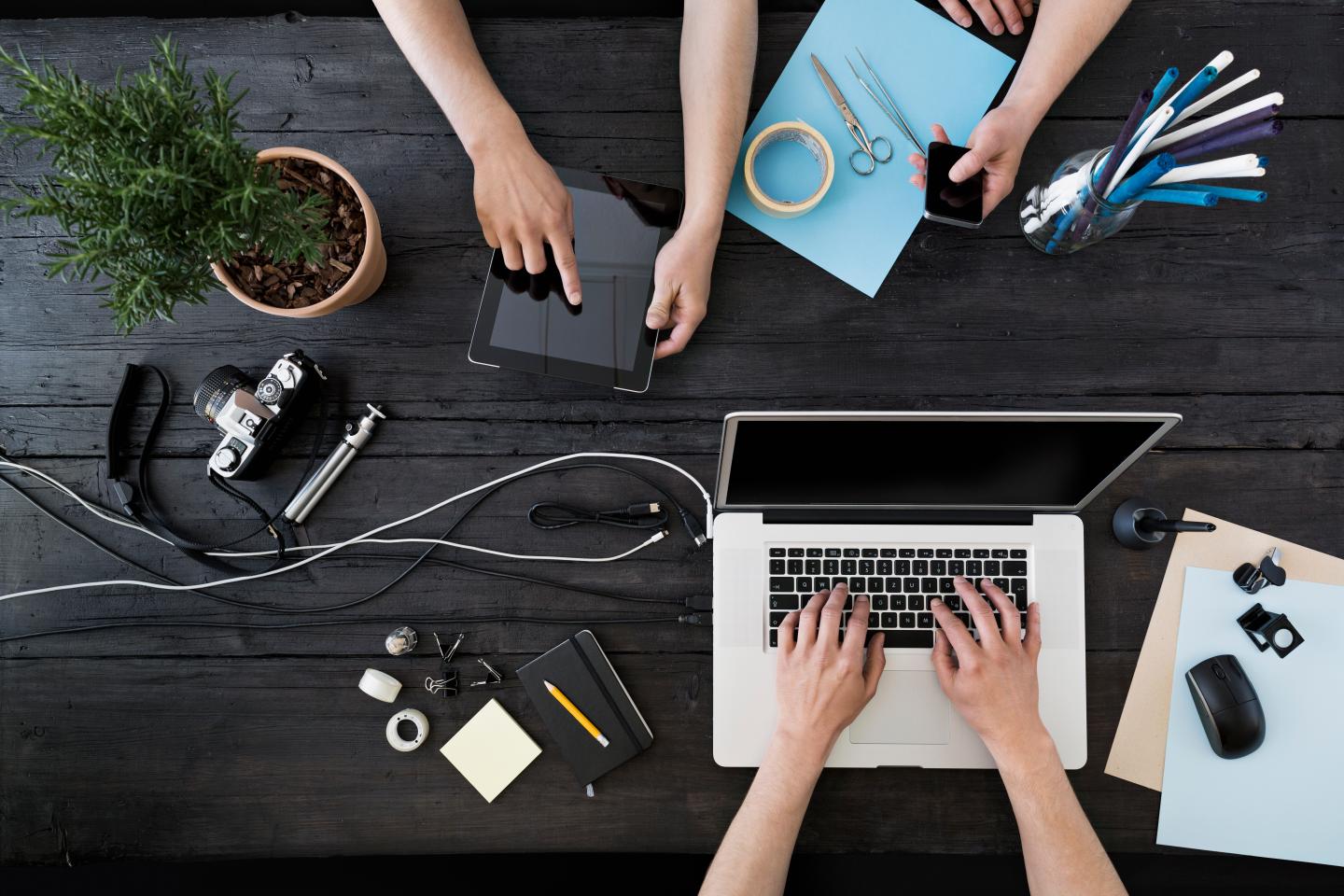 Working at home office with laptop, smartphone and digital tablet