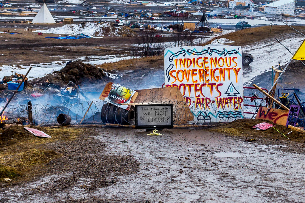 Defiant Dakota Access Pipeline water protectors faced-off