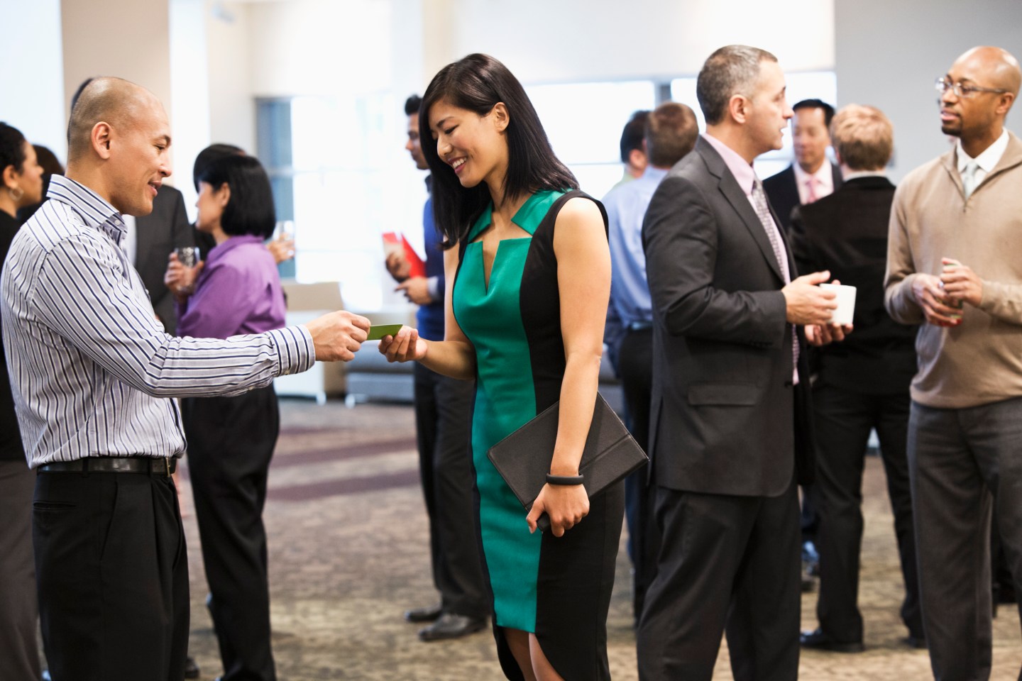 Exchanging business cards at conference