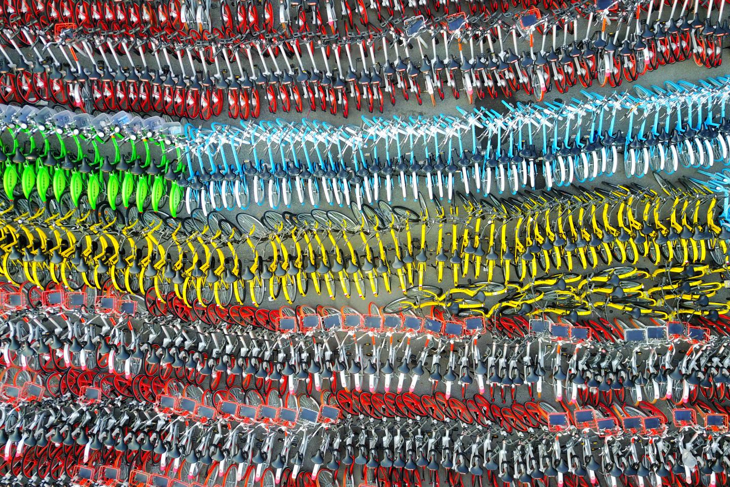 Confiscated sharing bicycles of different brands are seen at a parking lot of Huangpu District Vehicle Management Company in Shanghai