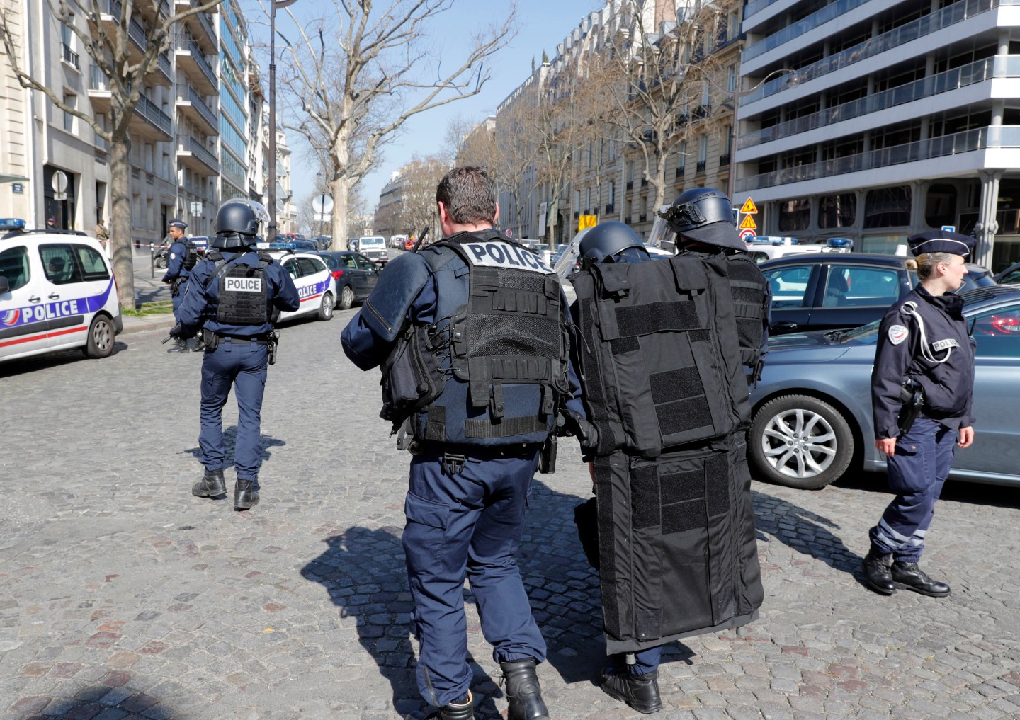 Police outside the International Monetary Fund offices where an envelope exploded in Paris