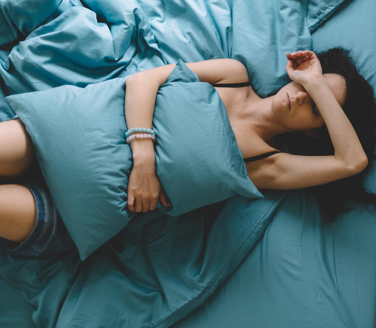Sick woman in bed