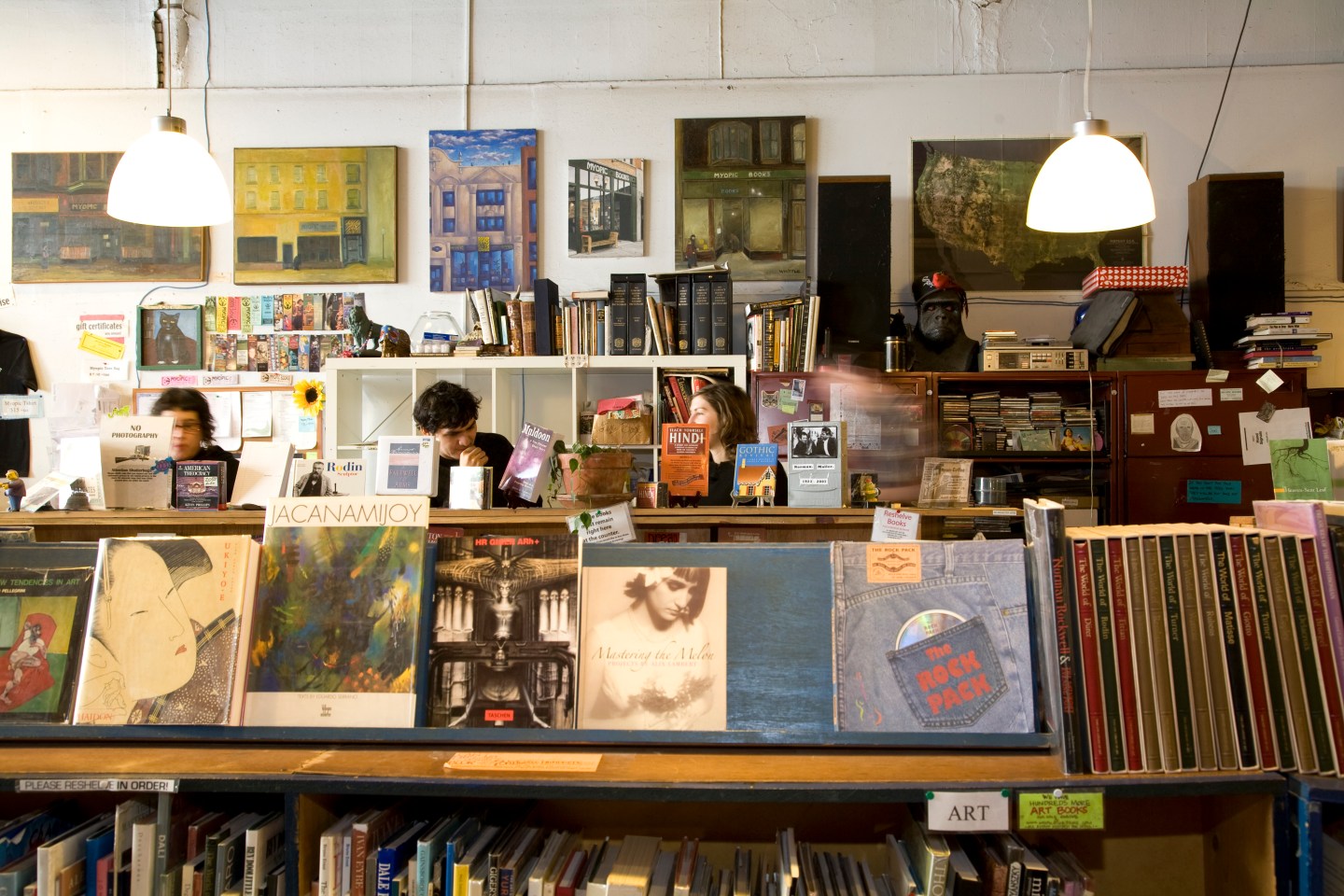 Books for sale at Myopic Books, with employees behind counter, Wicker Park.
