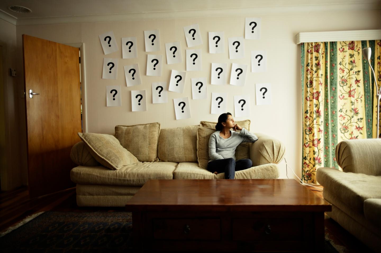 Questions mark on wall