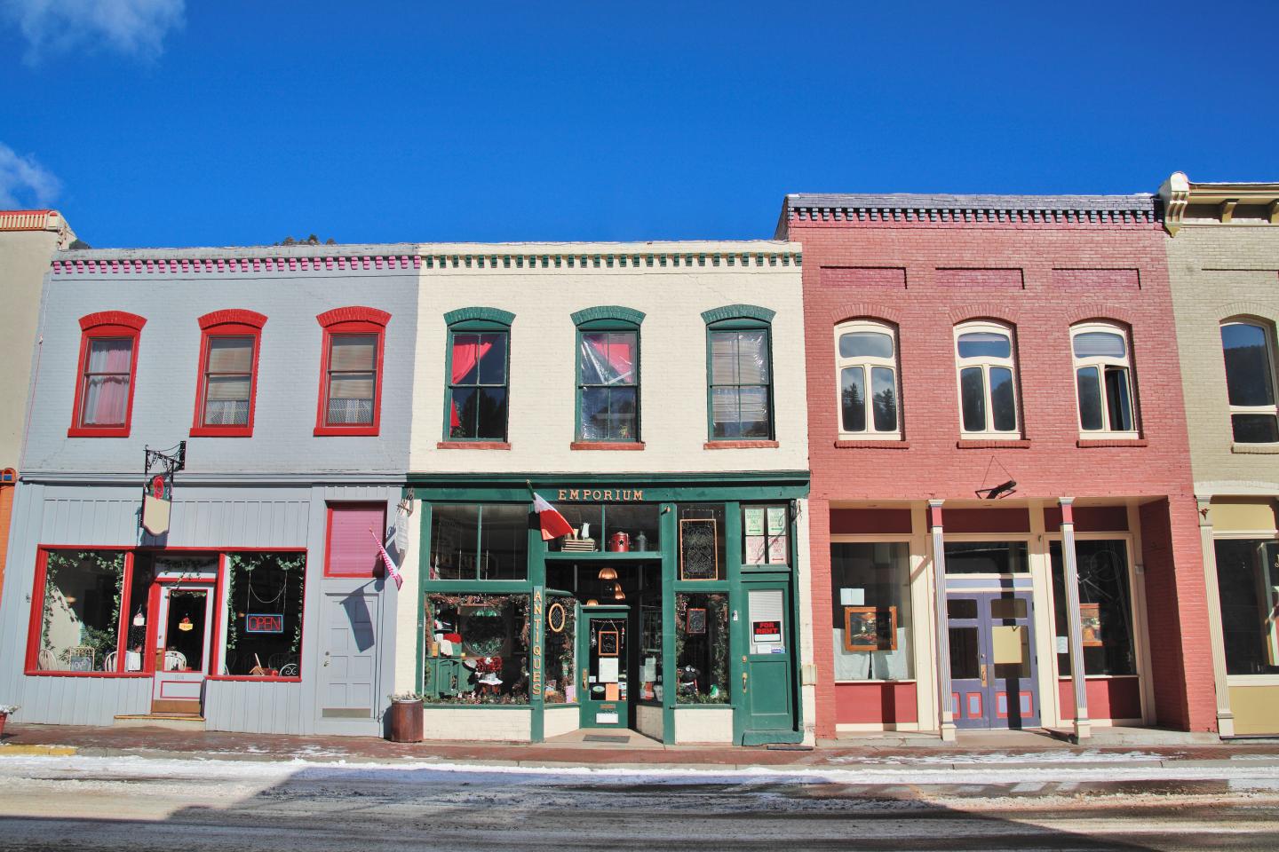 Storefronts along street, winter