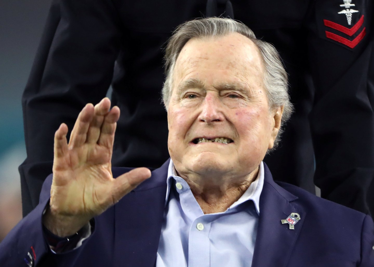 FILE PHOTO: Former U.S. President George H.W. Bush arrives on the field ahead of the start of Super Bowl LI between the New England Patriots and the Atlanta Falcons in Houston