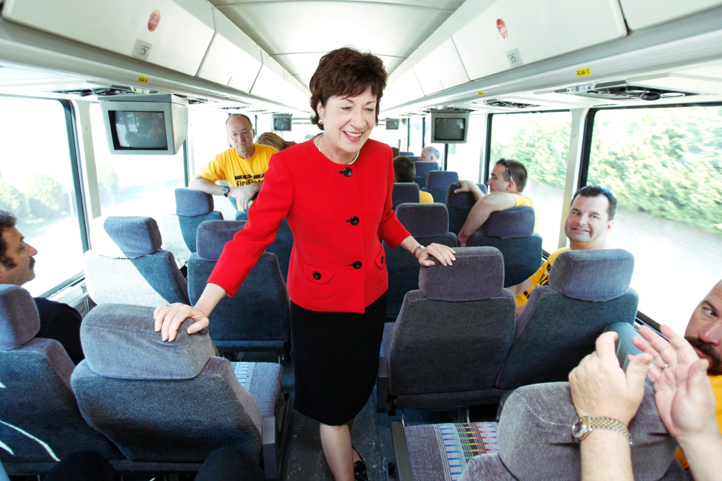 Sen. Susan Collins talks with firefighters while starting the first leg of a tour of fire departmen