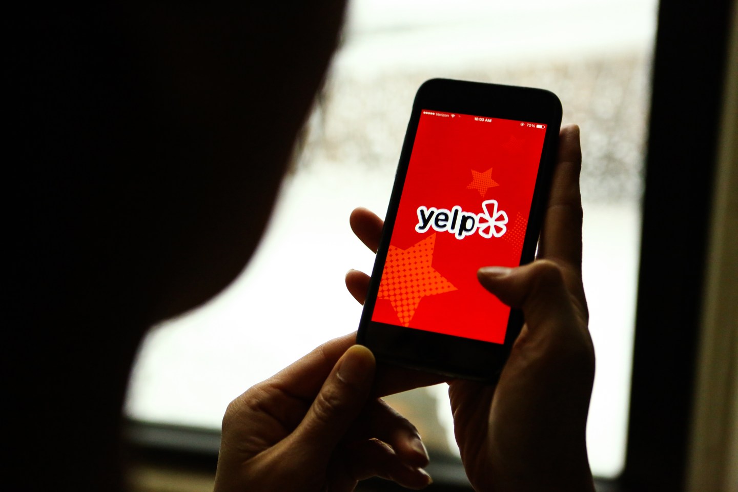 The Yelp app is displayed on an Apple Inc. iPhone in an arranged photograph taken in New York, U.S., on Friday, Feb. 5, 2016.