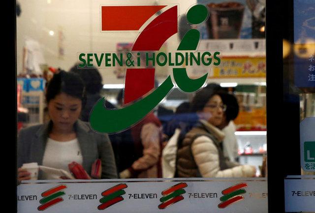 FILE PHOTO: People are seen at Seven & i Holdings Co's Seven Eleven convenience store in Tokyo