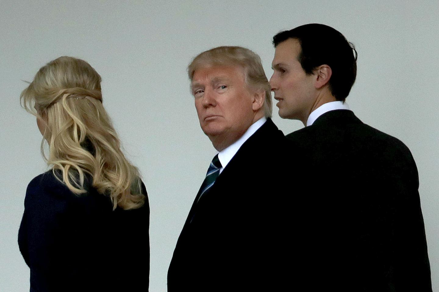 U.S. President Donald Trump (C) walks along the West Wing colonnade with his daughter Ivanka Trump (L) and his son-in-law and Senior Advisor to the President for Strategic Planning Jared Kushner
