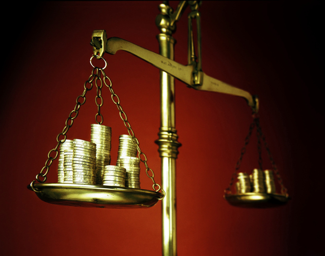 Gold coins being weighed on gold scale