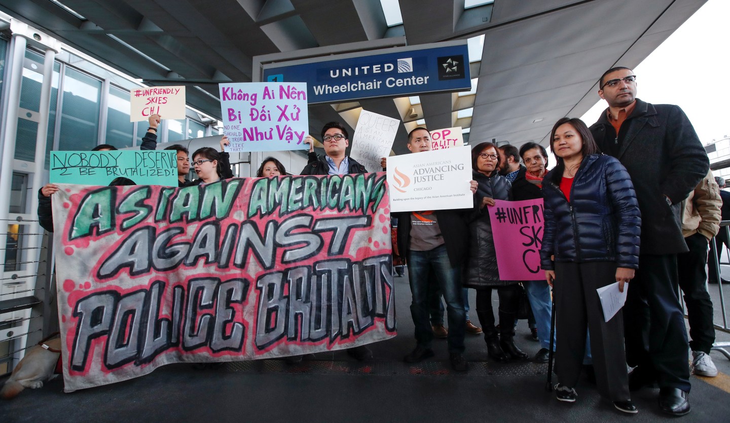 Community members protest the treatment of Dr. David Dao, who was forcibly removed from a United Airlines flight on Sunday by the Chicago Aviation Police, at O&#8217;Hare International Airport in Chicago, Illinois, U.S., April 11, 2017.