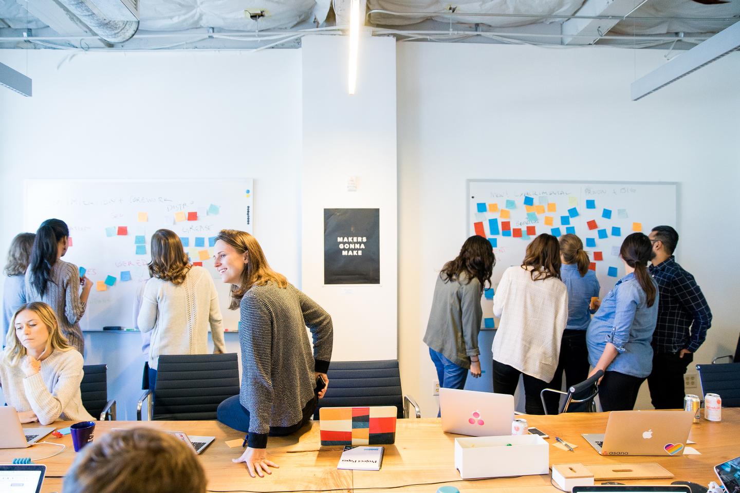 Asana employees brainstorm session.