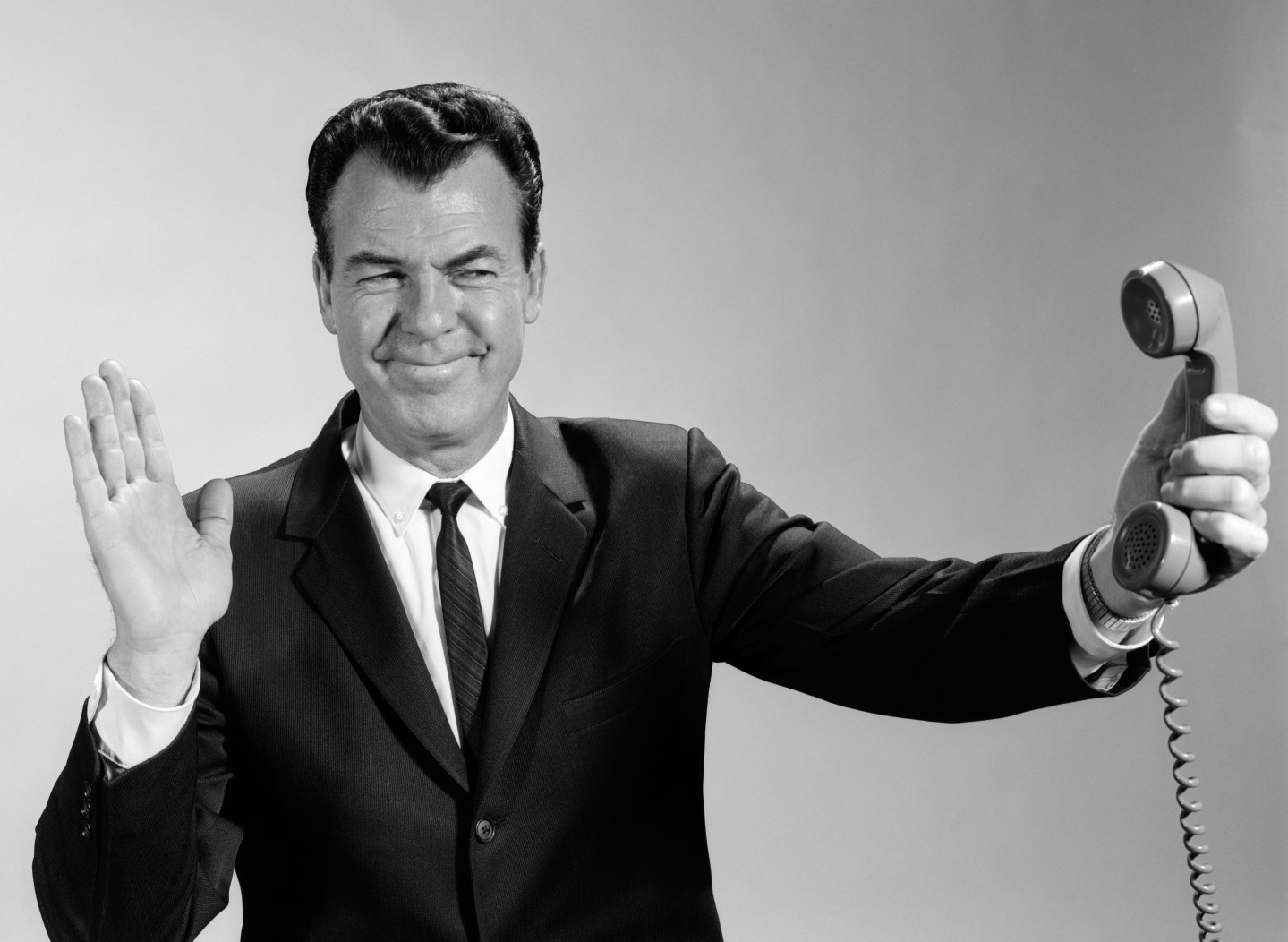 1960s BUSINESSMAN HOLDING...