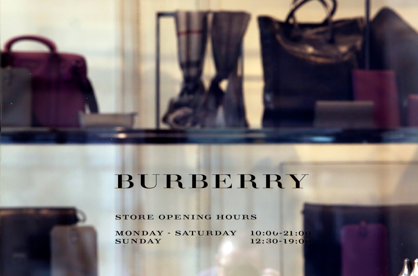 Burberry Group Plc Stores And Apple Inc. Logos As Apple Poach Burberry's Ahrendts
