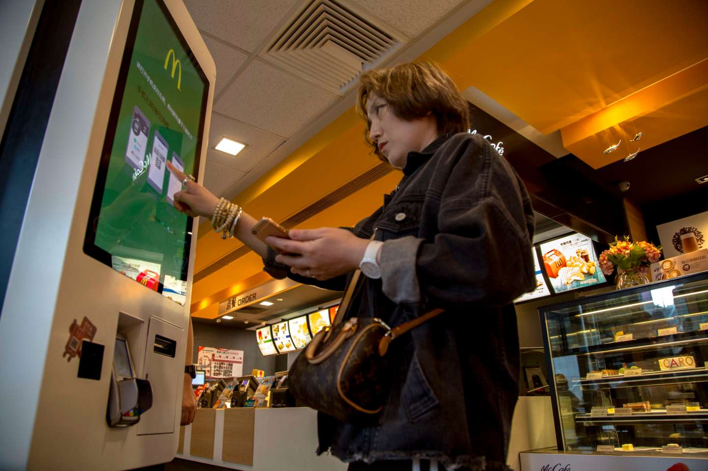 A vending machine in a McDonald's restaurant.  Customers can