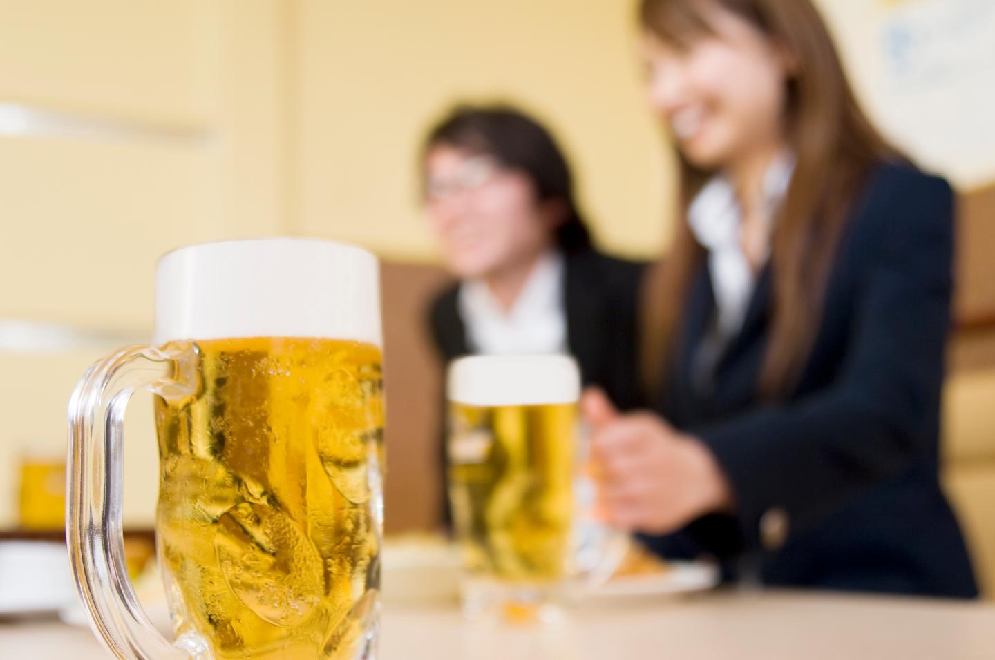 Young man and woman with beer