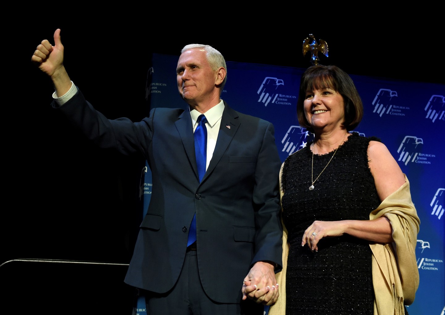 U.S. Vice President Mike Pence, left, and his wife, Karen Pence acknowledge the audience before he speaks at the Republican Jewish Coalition's annual meeting in Las Vegas