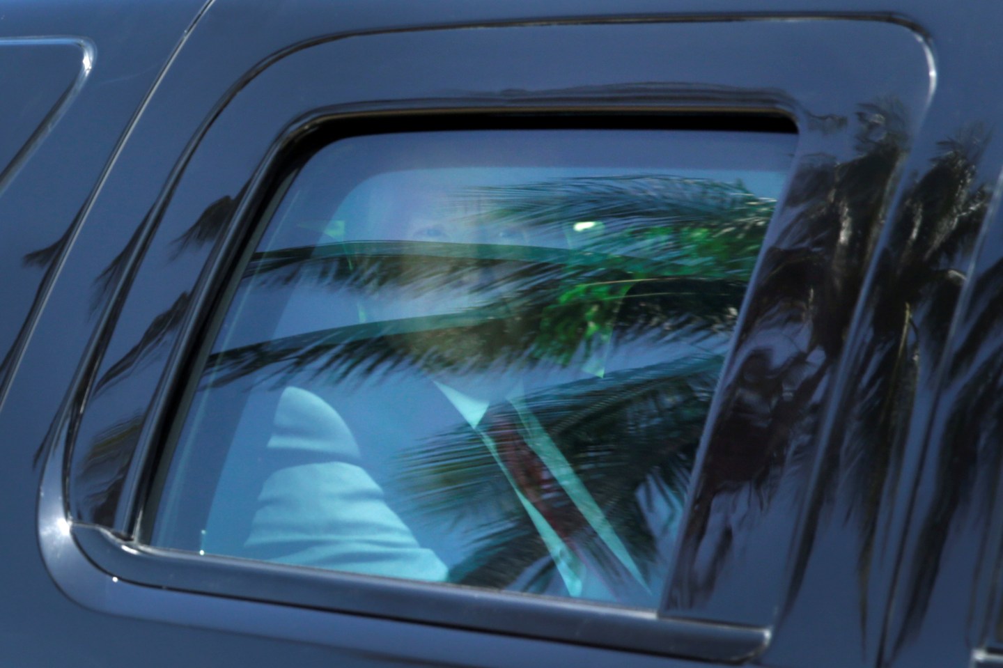 President Donald Trump leaves in his limousine after attending an Easter Sunday service