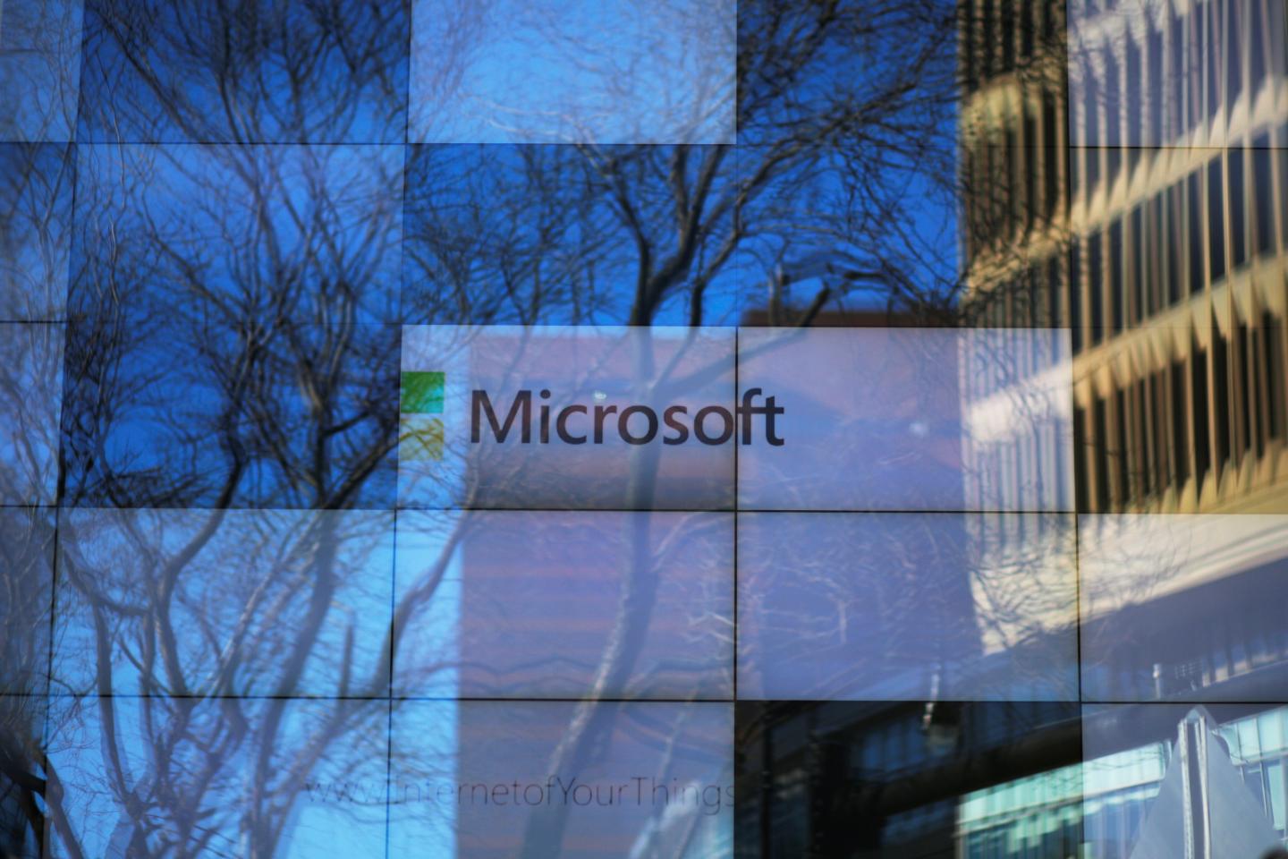 An advertisement is played on a set of large screens at the Microsoft office in Cambridge