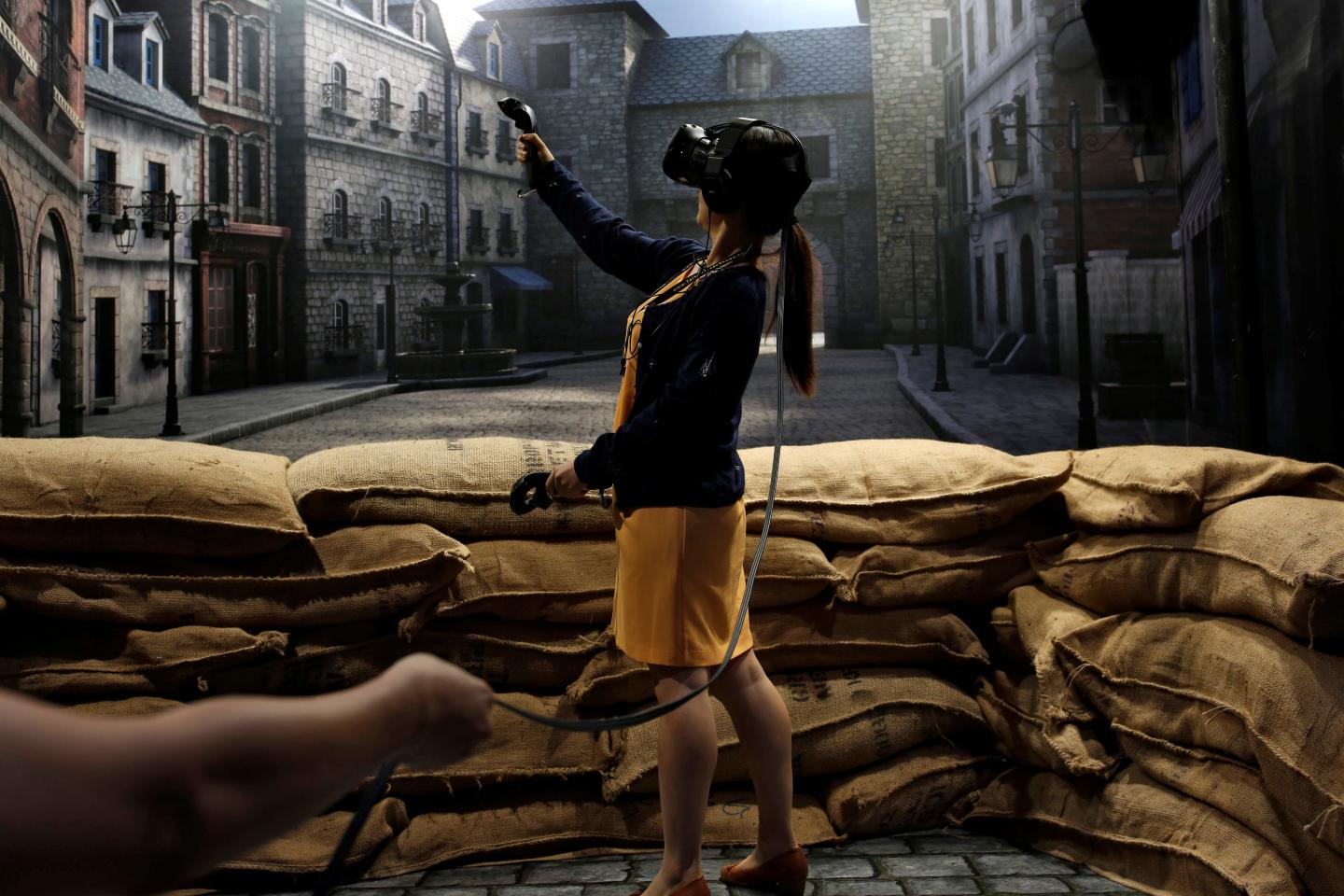 A visiter tries a pair of HTC's Vive Virtual Reality (VR) goggles, during the annual Computex computer exhibition in Taipei