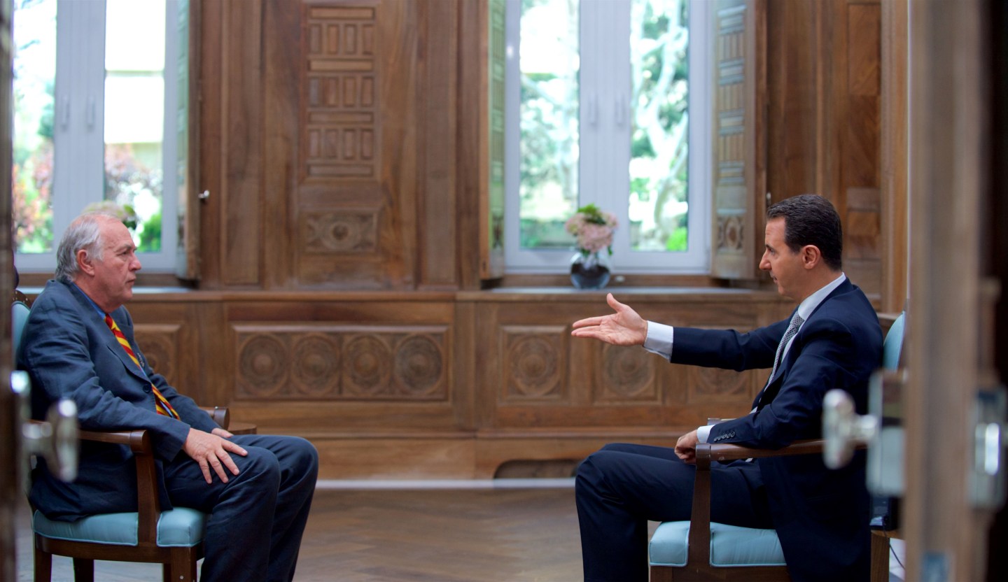 Syria's President Bashar al-Assad speaks during an interview with AFP news agency in Damascus