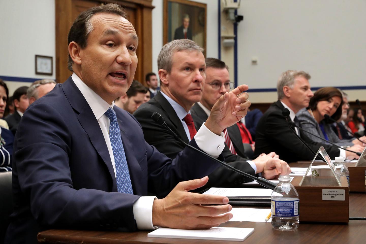 United Airlines CEO Oscar Munoz (left) testifies before the House Transportation and Infrastructure Committee about oversight of U.S. airline customer service.