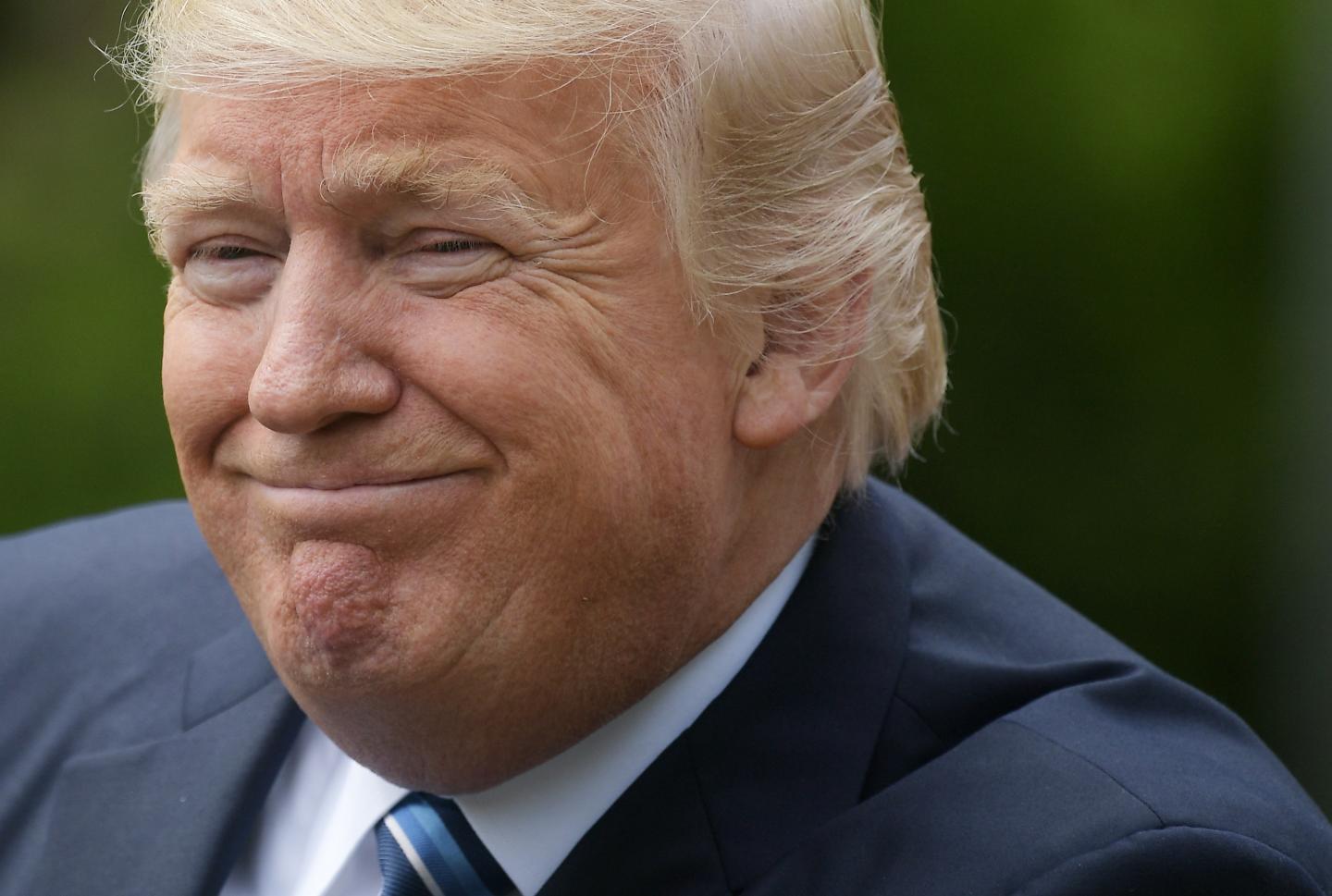 U.S. President Donald Trump smiles as he speaks before signing an Executive Order on Promoting Free Speech and Religious Liberty in the Rose Garden of the White House on May 4, 2017 in Washington, DC.