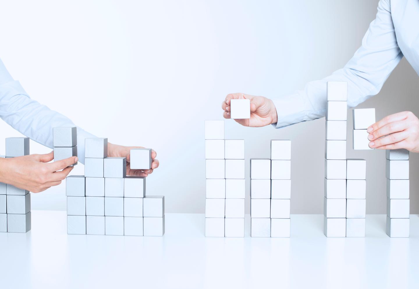 Two business woman building a project