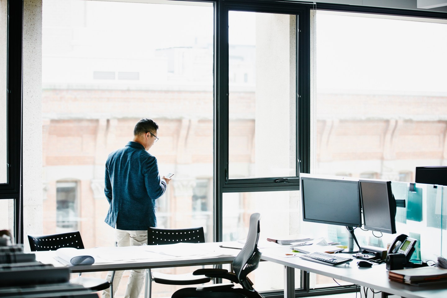 Businessman working on smartphone in office