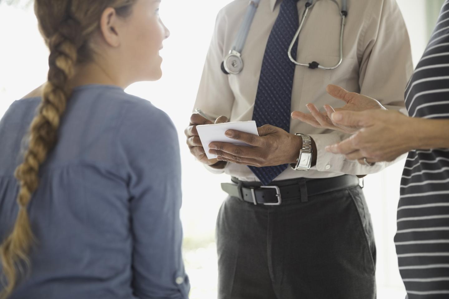 Mother having a conversation with doctor