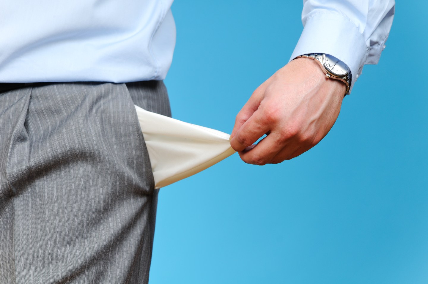 Man Pulling out Empty Pocket