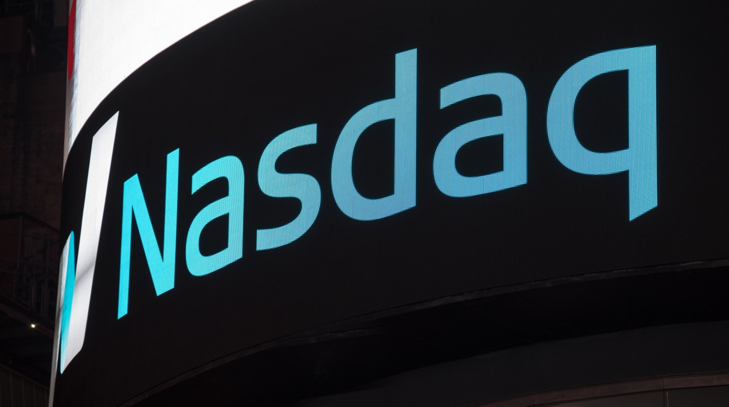 Nasdaq signage and logo on black background in New York City