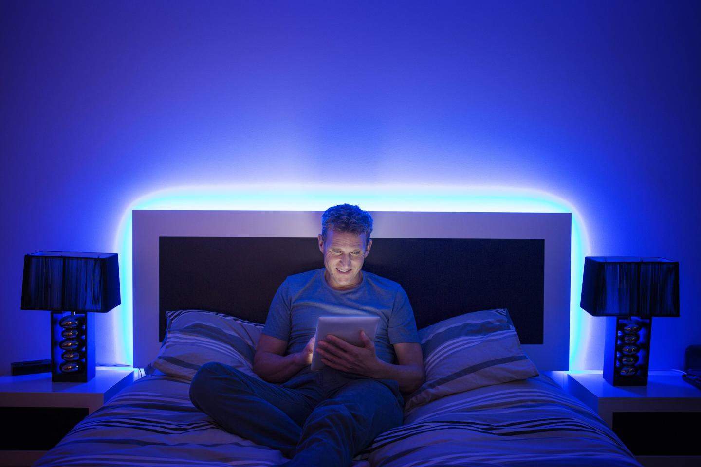 Man reading in bed