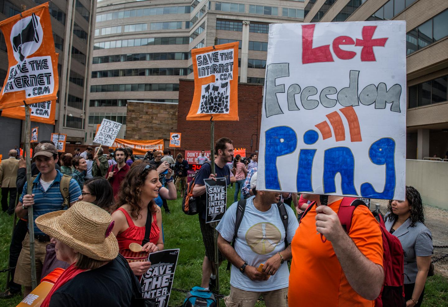 Protesters hold a rally before the FCC meeting on net neutrality proposal in Washington, DC.