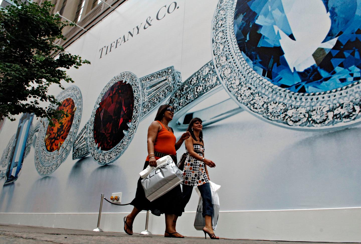 Pedestrians pass Tiffany &amp; Co.'s flagship store in New York,