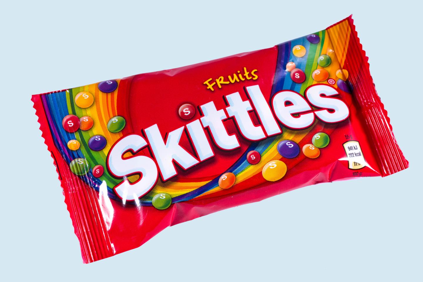 LONDON, UK - OCTOBER 13TH 2016: An unopened pack of Fruit Skittles over a plain white background, on 13th October 2016.