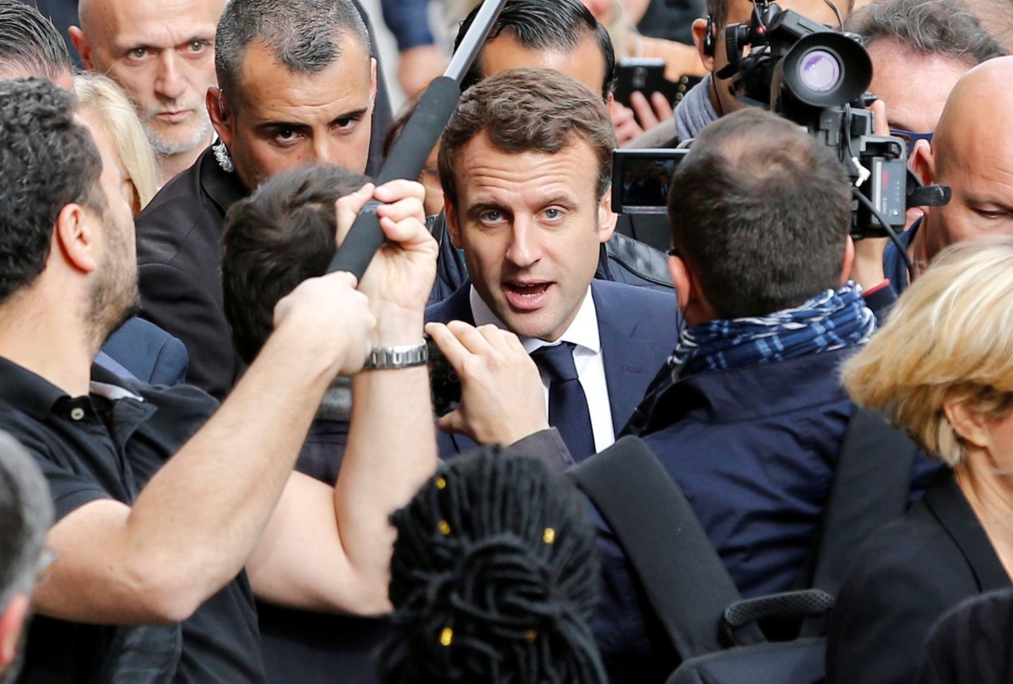 Emmanuel Macron, head of the political movement En Marche !, or Onwards !, and candidate for the 2017 presidential election, speaks with supporters during a campaign visit in Rodez