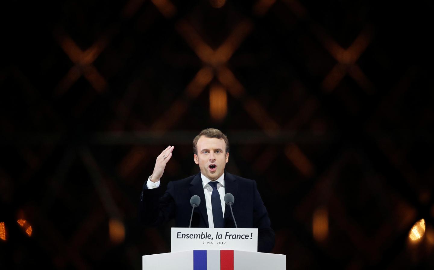 French President-elect Emmanuel Macron celebrates on the stage at his victory rally near the Louvre in Paris
