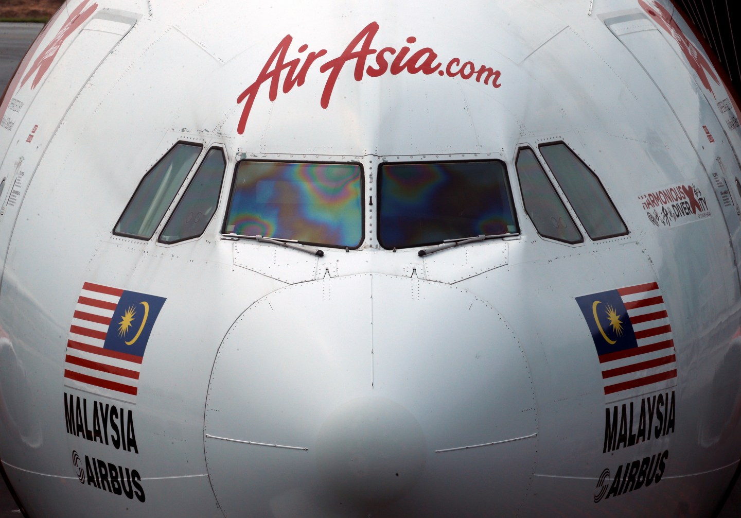 An AirAsia plane sits on the tarmac at Kuala Lumpur International Airport
