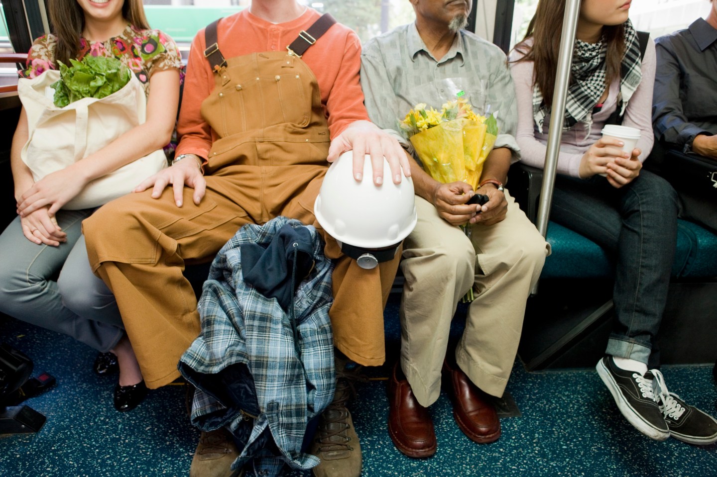 Multi-ethnic commuters on bus