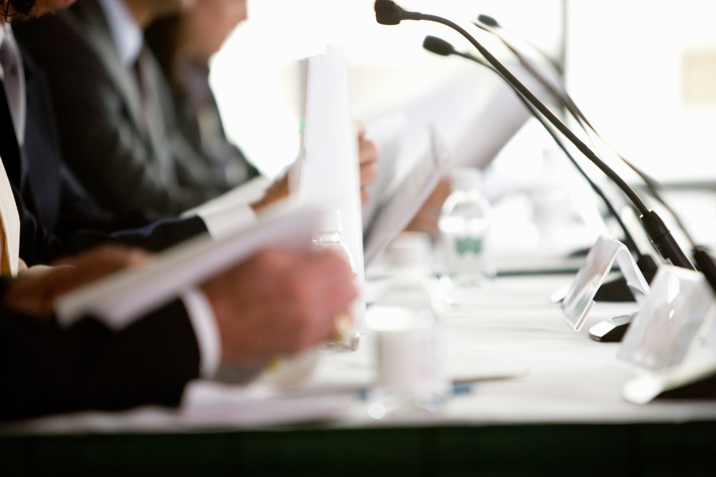 Panelists at conference table