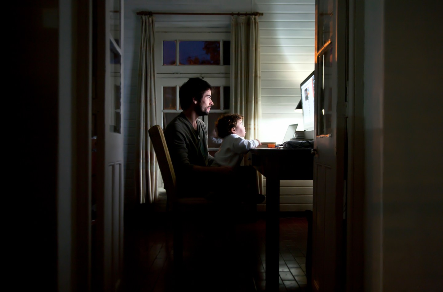 Father and son watching the computer