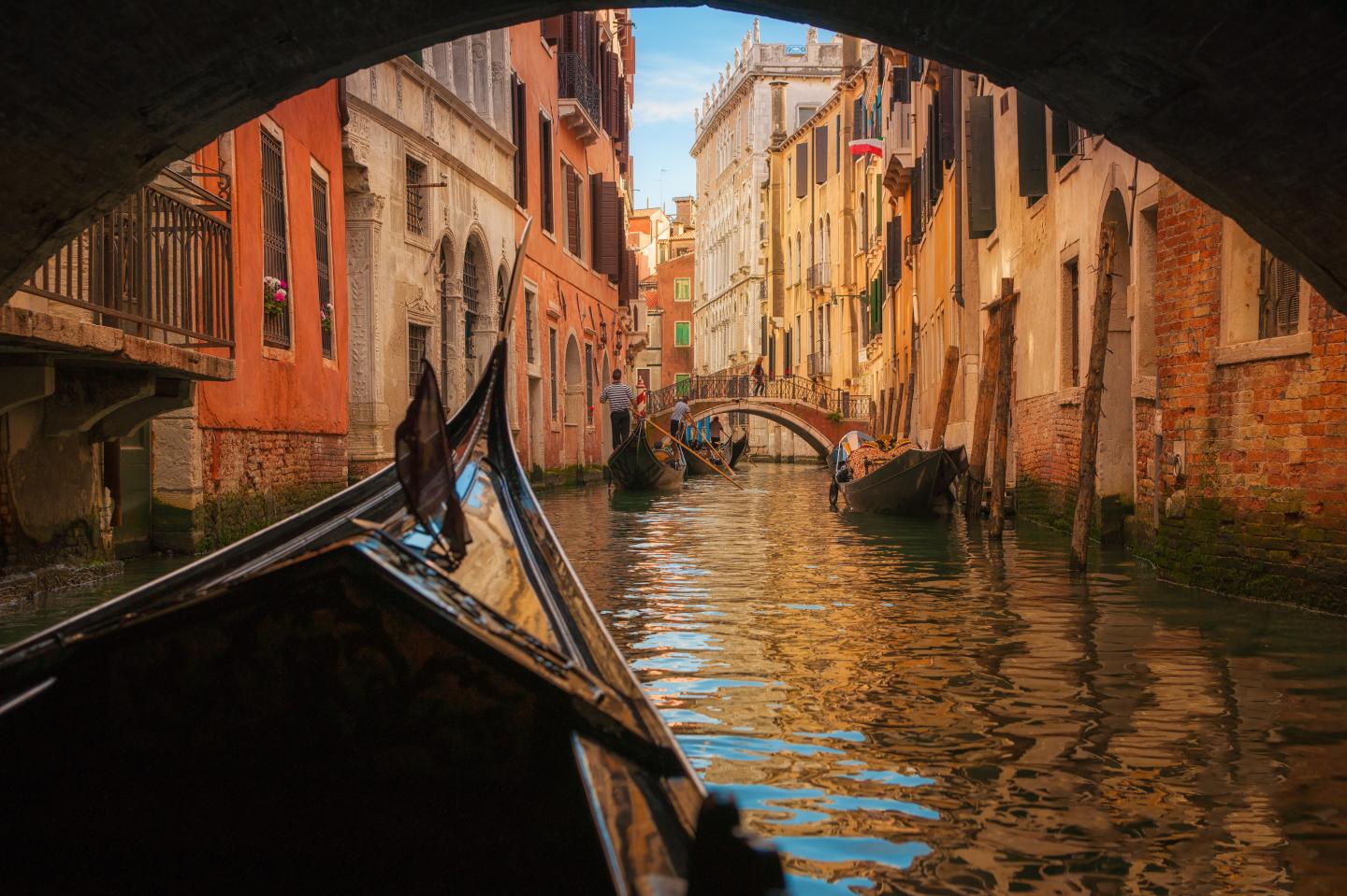 Italy, Veneto, Venice, Gondola under bridge