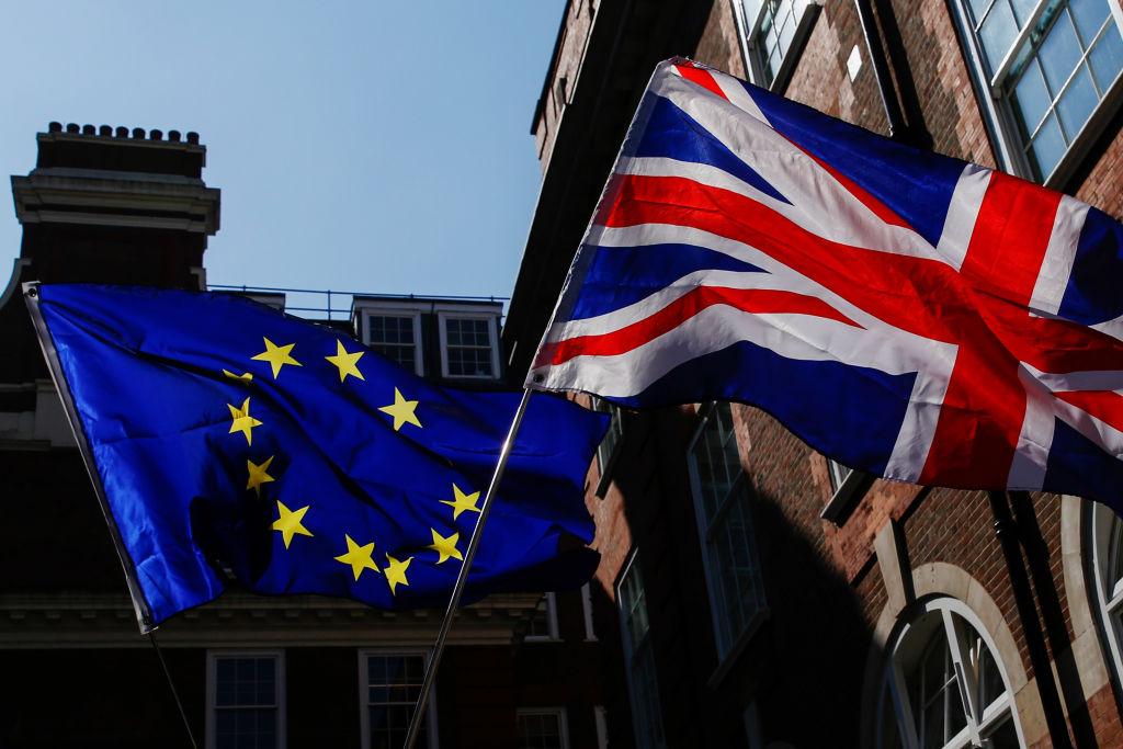 Pro-Europe and anti-Brexit campaigners demonstrate outside the offices of Prime Minister Theresa May's governing party the Conservative Campaign Headquarters  in London