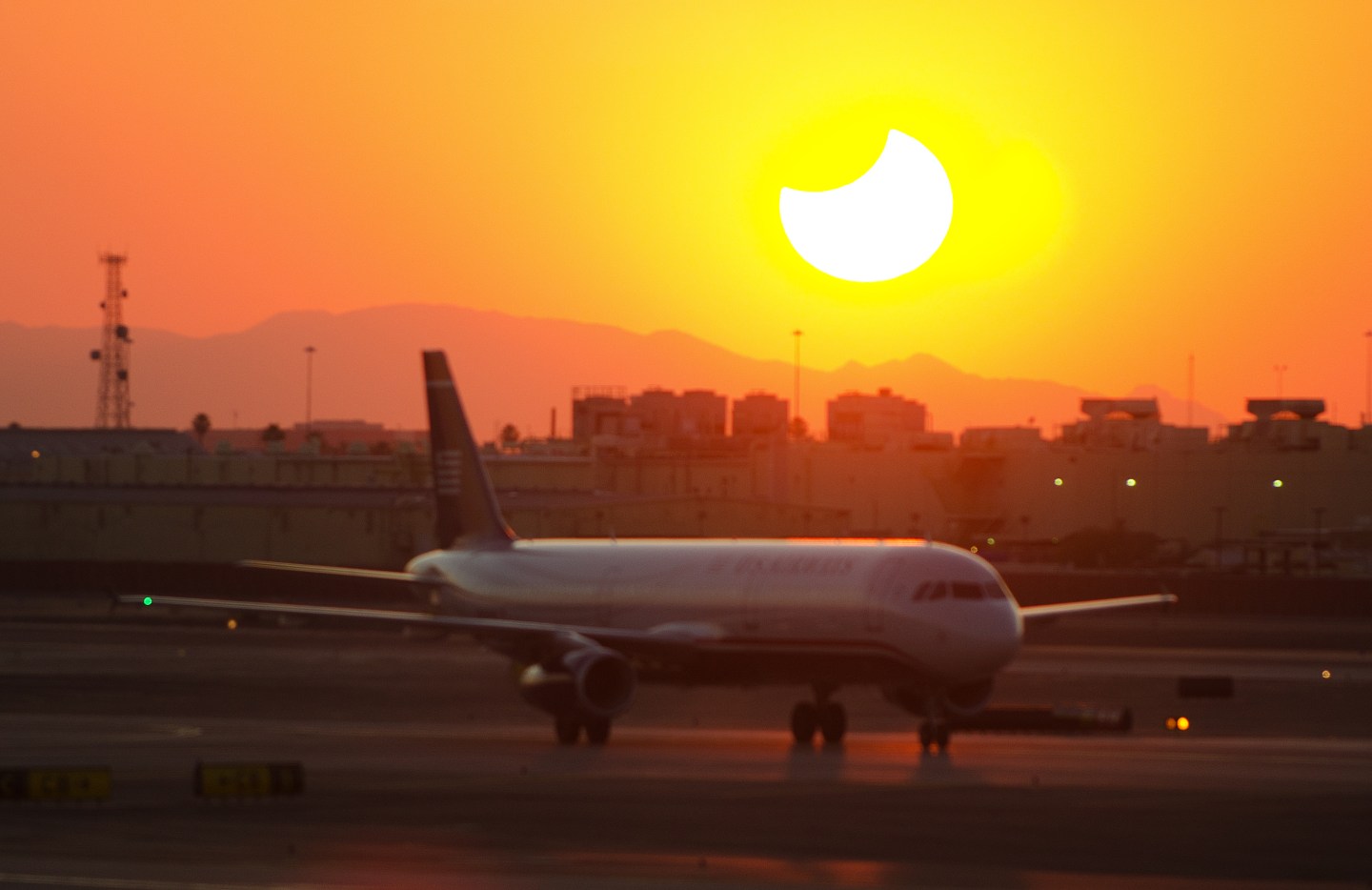 An eclipse of the sun is seen thru windo