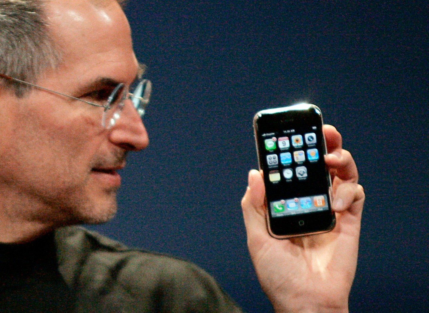 Apple Chief Executive Officer Steve Jobs holds new iPhone in San Francisco
